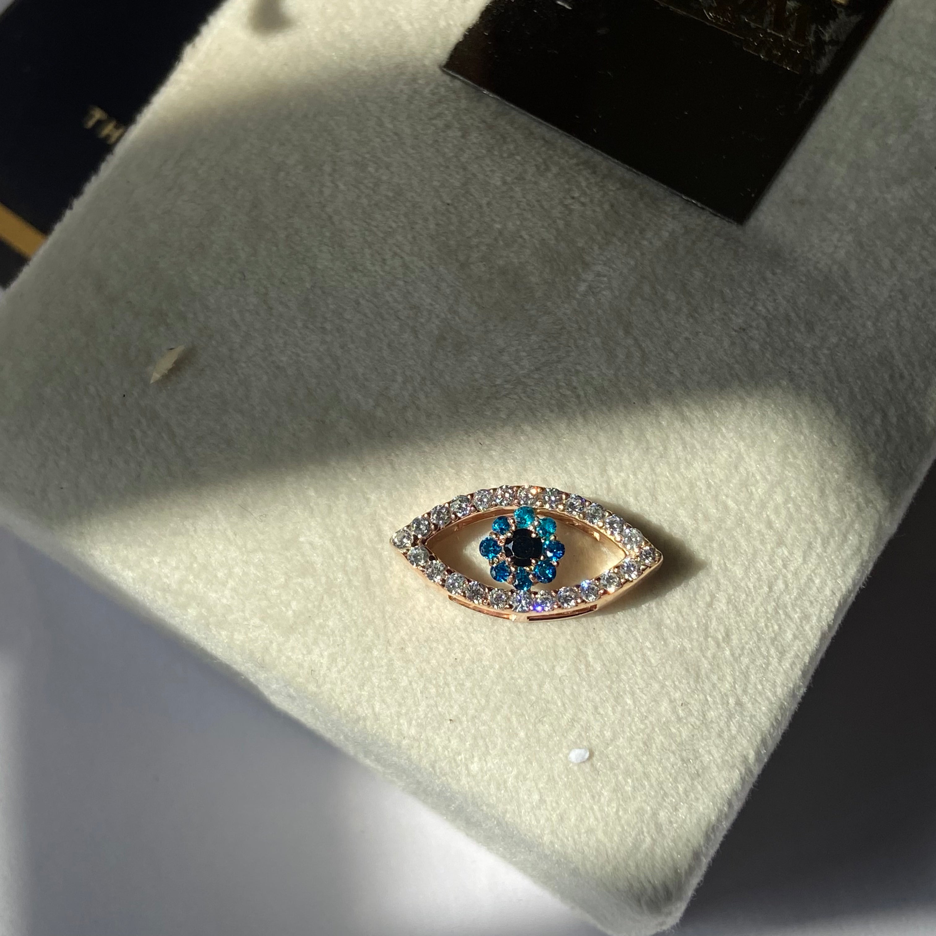 Diamond and sapphire evil eye