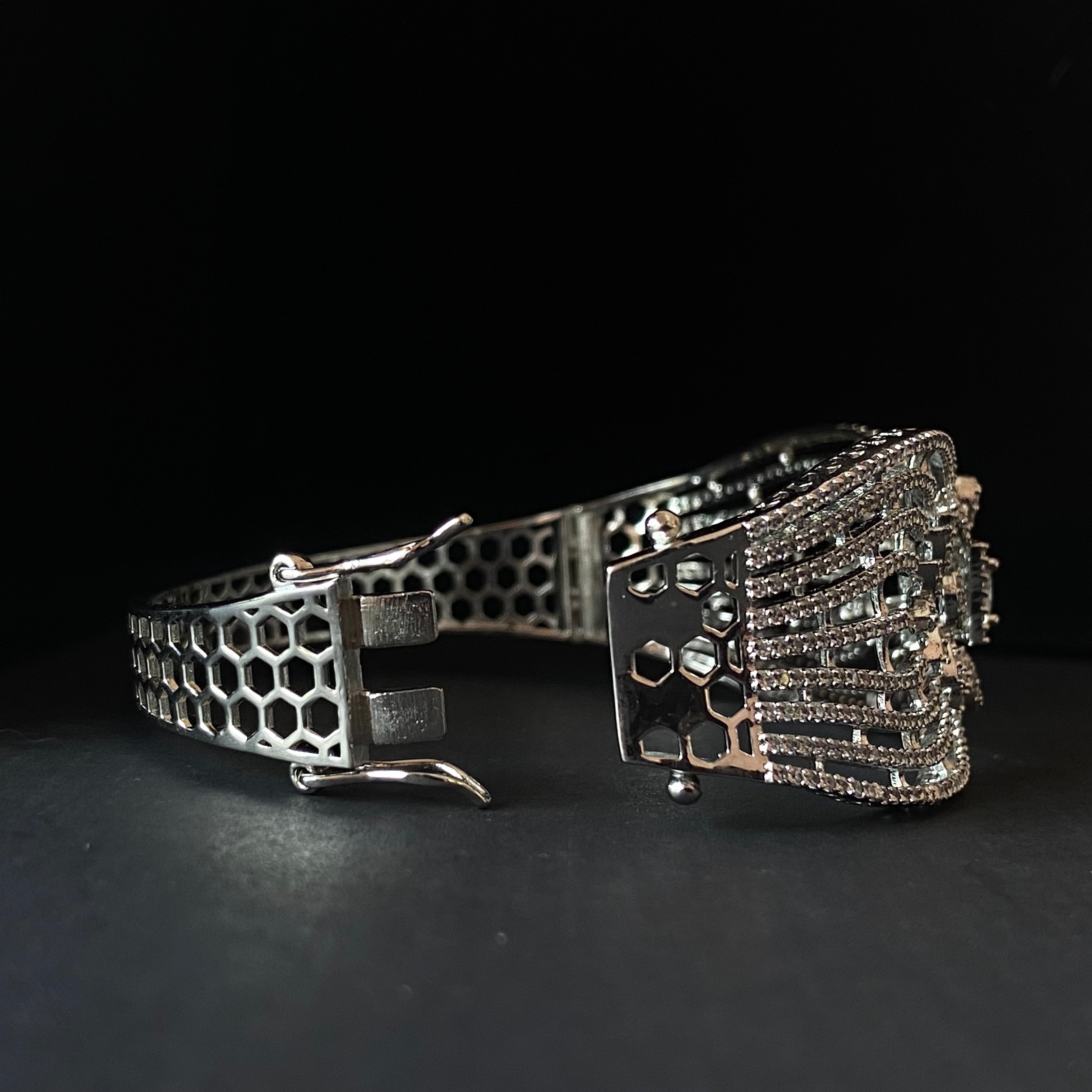 “WOKE” openable white gold bracelet