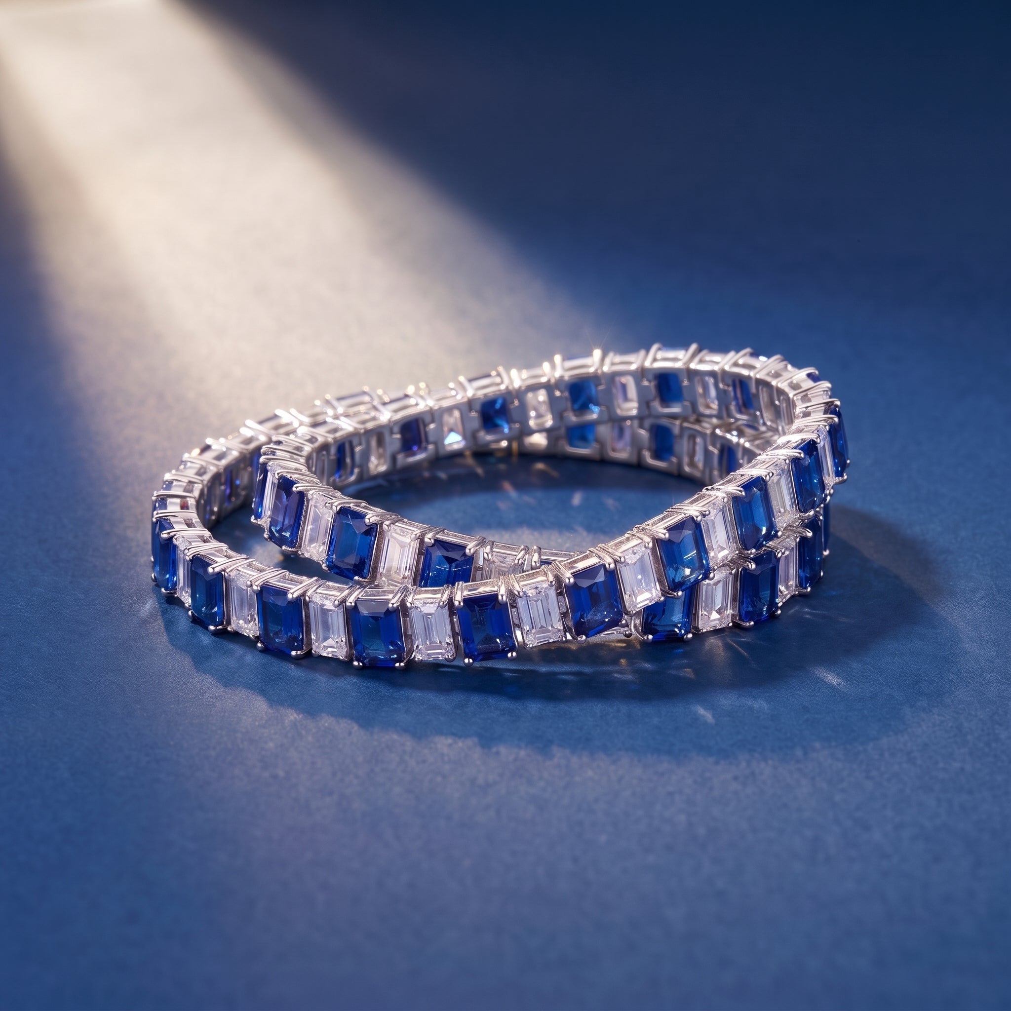 Blue and white tennis bracelets on royal blue