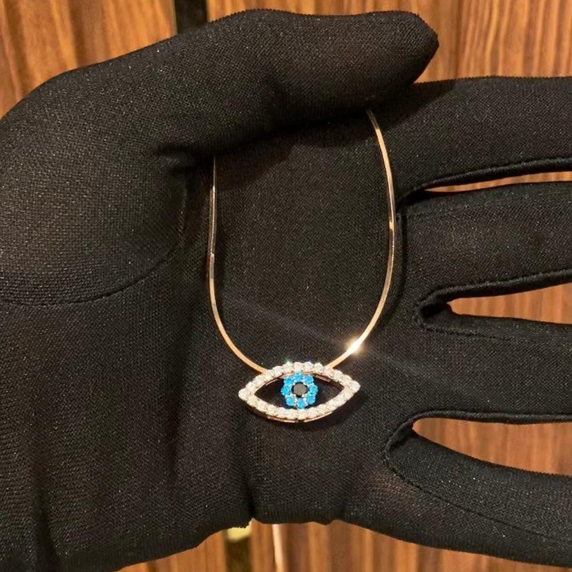 Diamond and sapphire evil eye